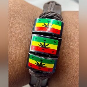 Rasta brown leather wrist bracelet with weed leaf emblem. Bohemian.